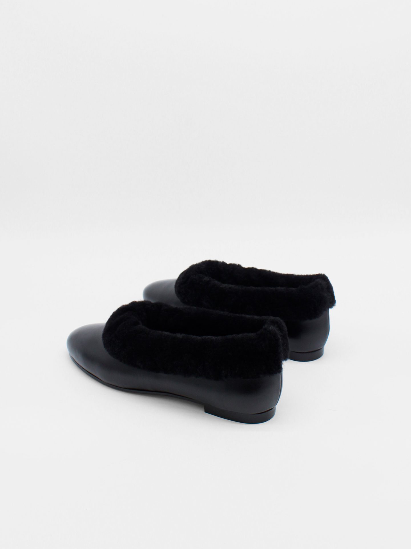 About Arianne Elias Black Flats