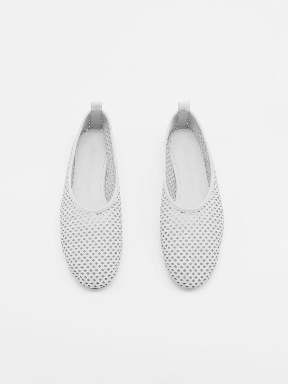 About Arianne Elio White Flats