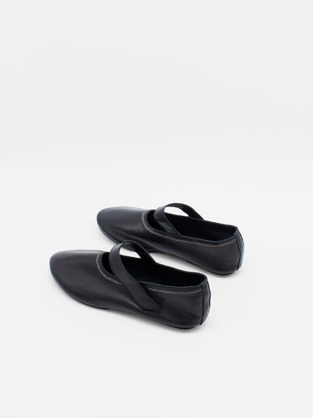 About Arianne Martino Black Flats