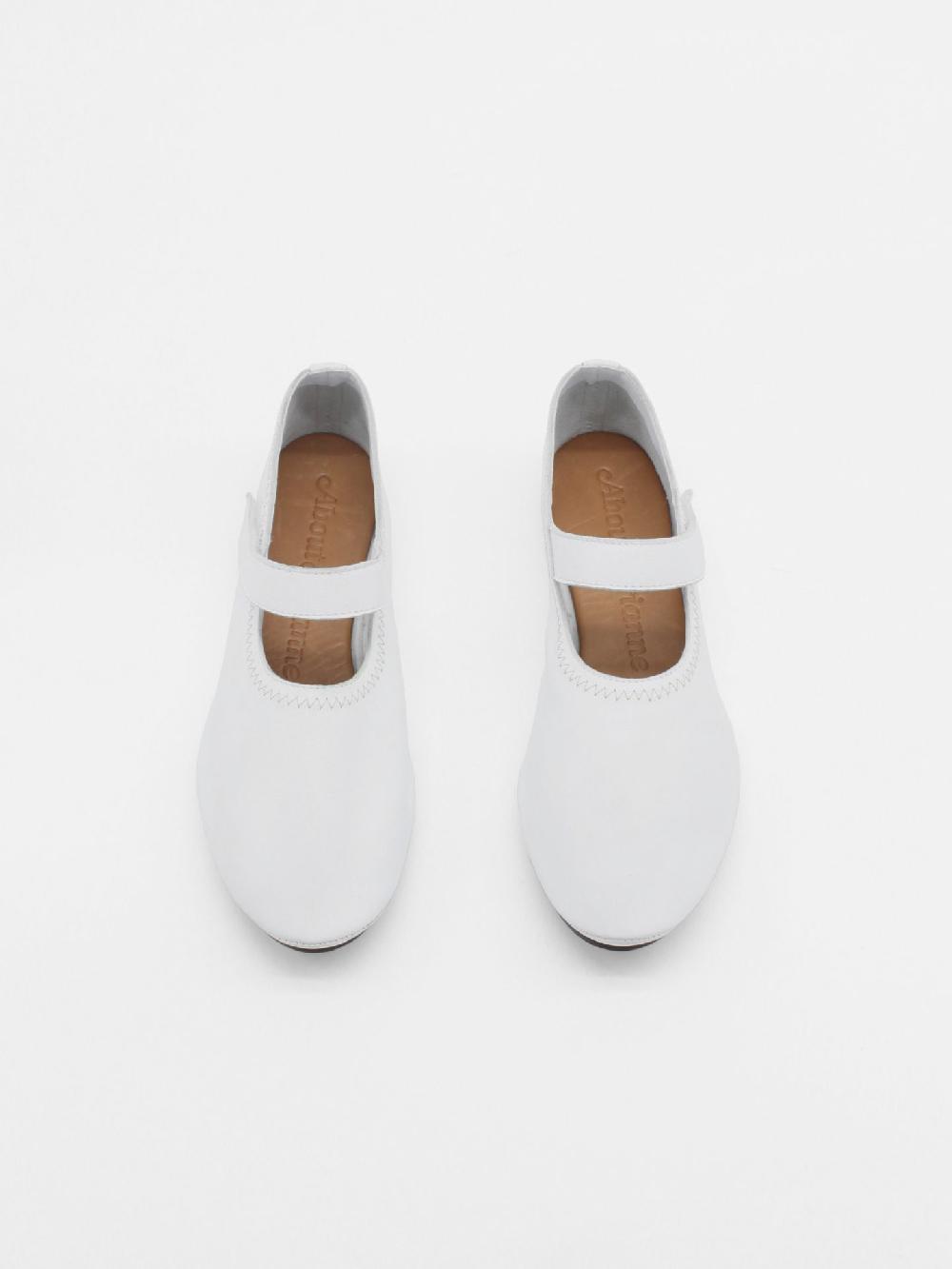 About Arianne Martino White Flats