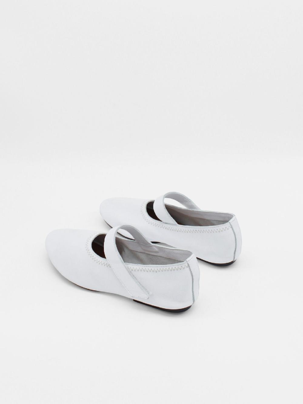 About Arianne Martino White Flats