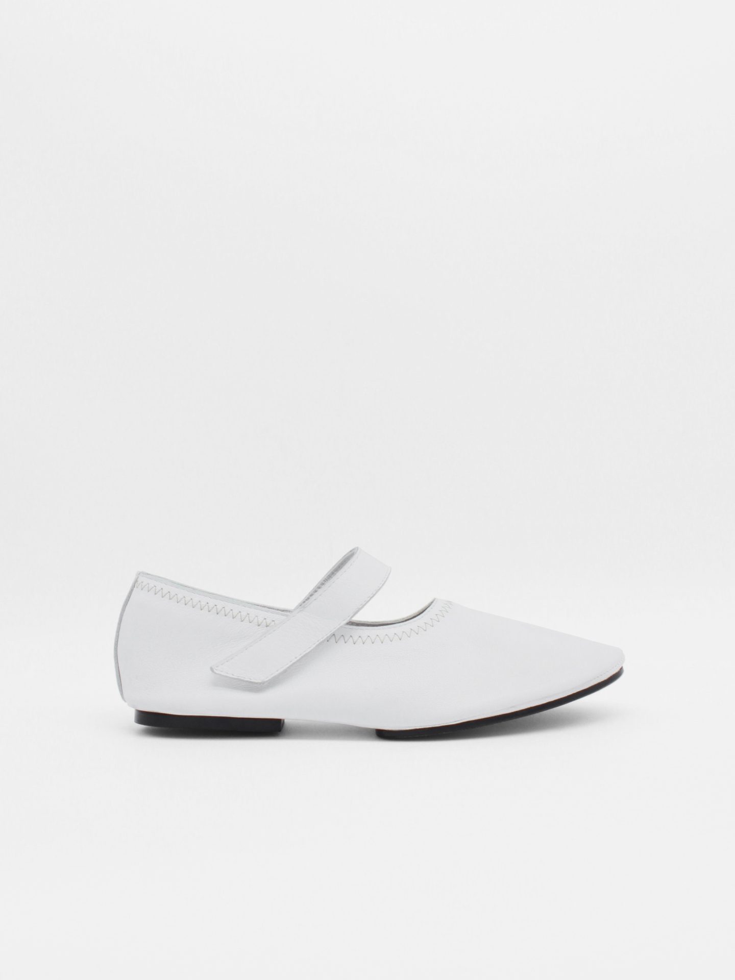 about arianne Martino White Flats