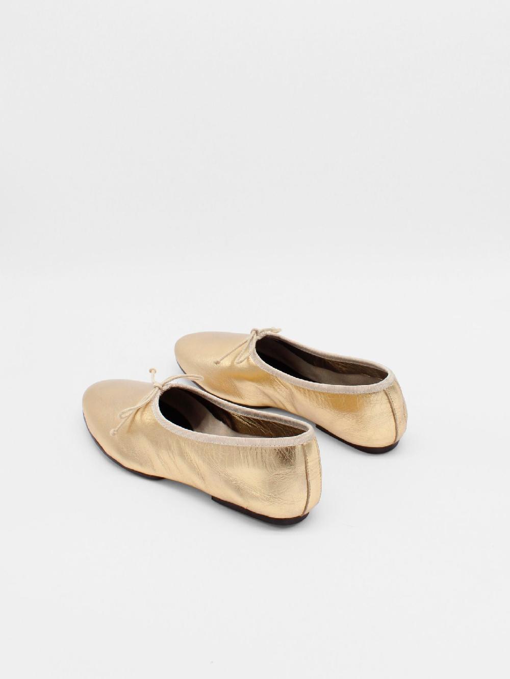 about Arianne Mila Gold Flats
