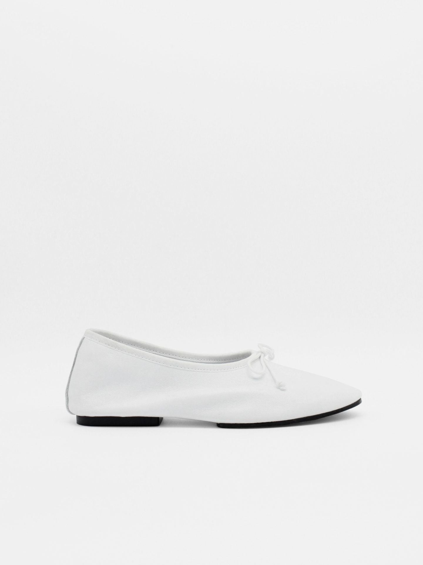 About Arianne Mila White Flats