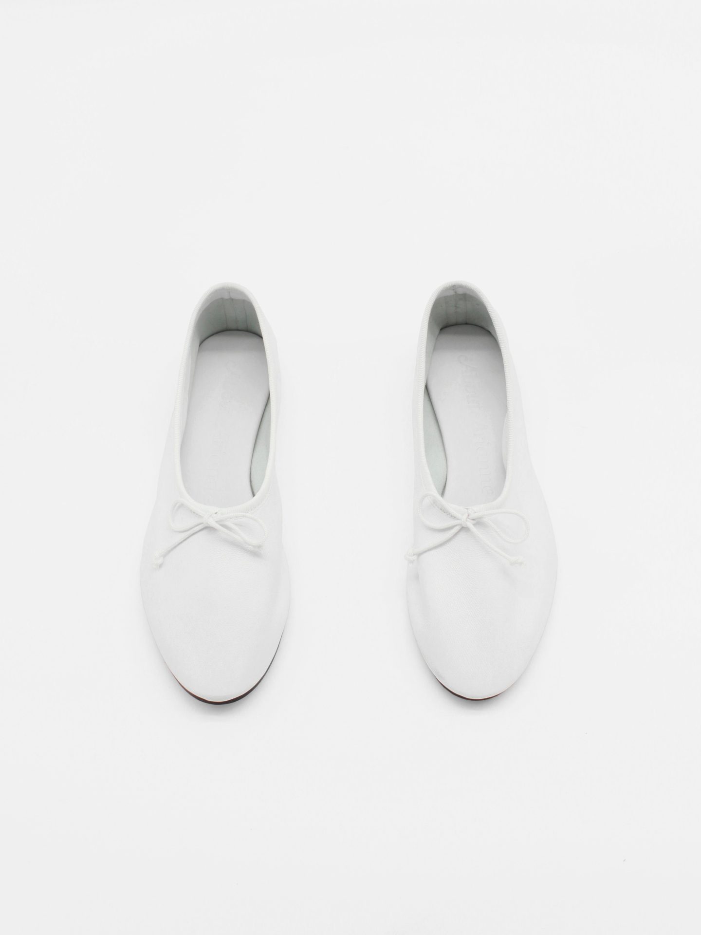 About Arianne Mila White Flats