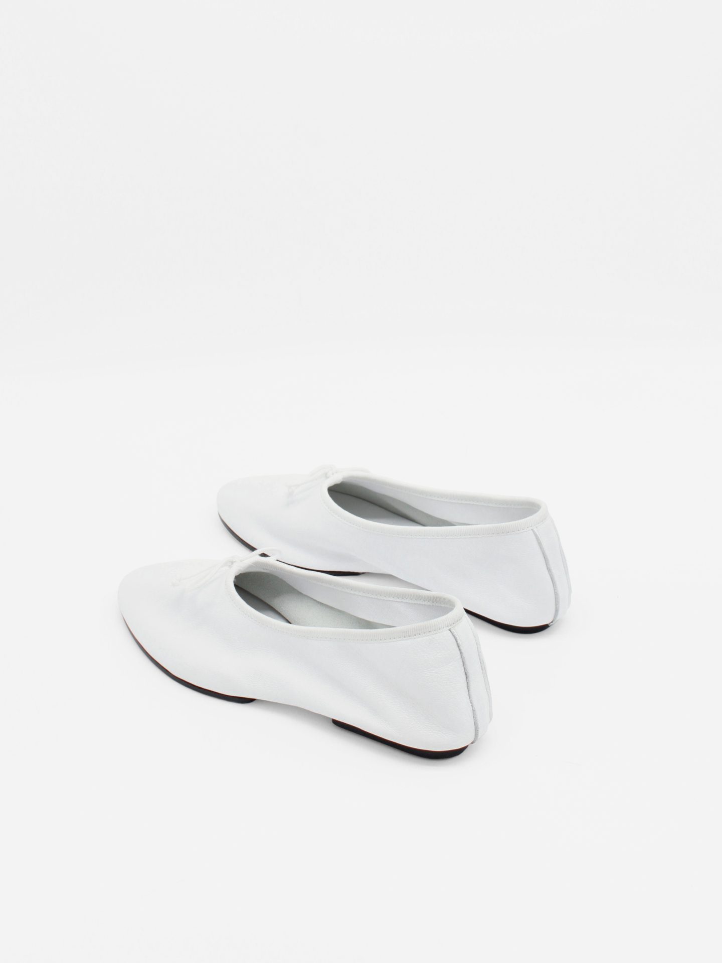 About Arianne Mila White Flats