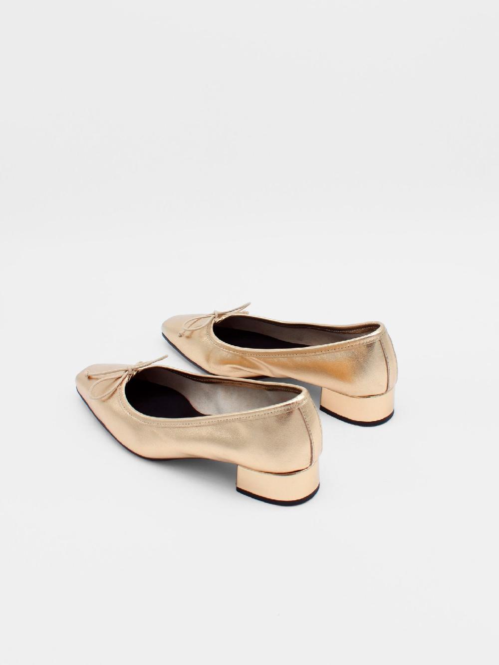 About Arianne Mina Gold Flats