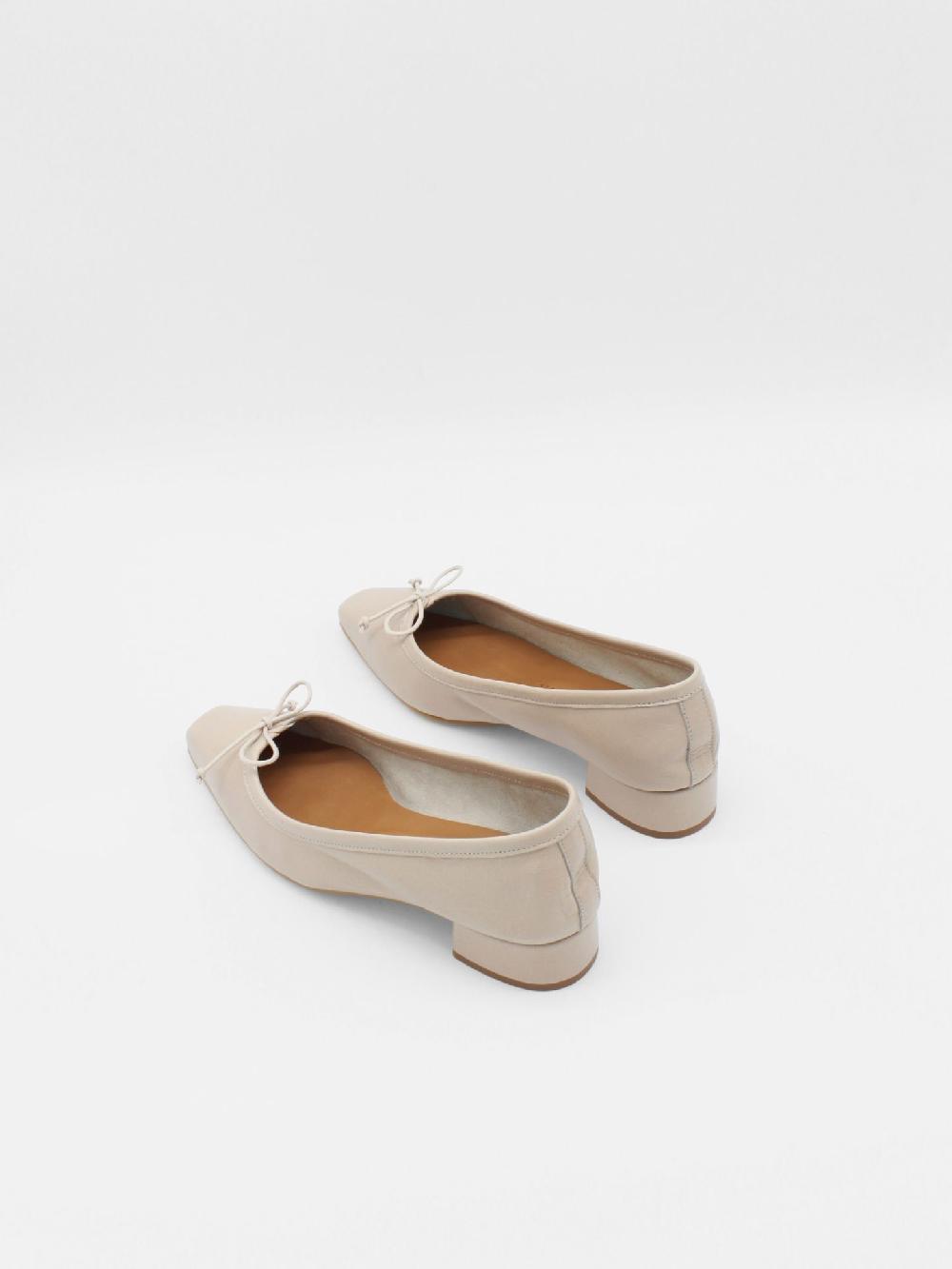 About Arianne Mina Tan Flats