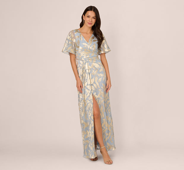 Aidan Mattox Foil Leaf Short Sleeve Gown With Draped Details In Light Blue Gold