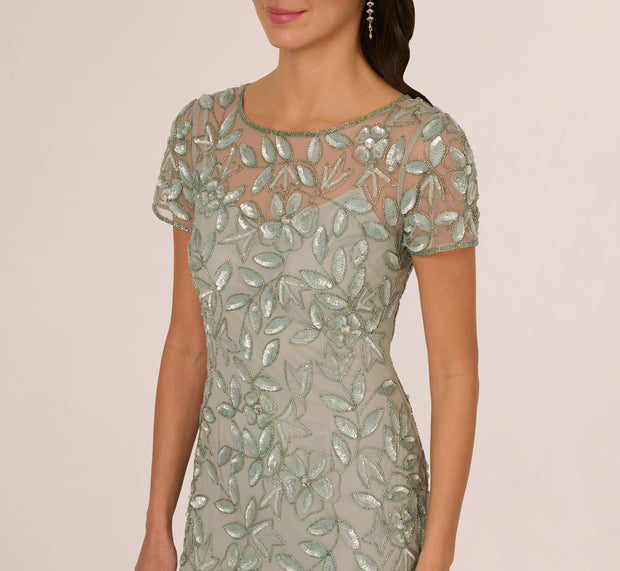 Aidan Mattox Hand Beaded Short Sleeve Floral Godet Gown In Frosted Sage