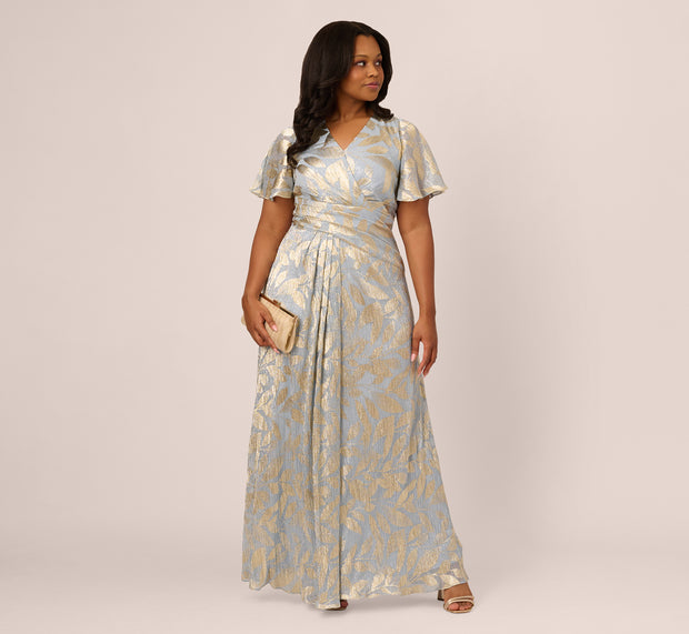 Aidan Mattox Plus Size Foil Leaf Short Sleeve Gown With Draped Details In Light Blu