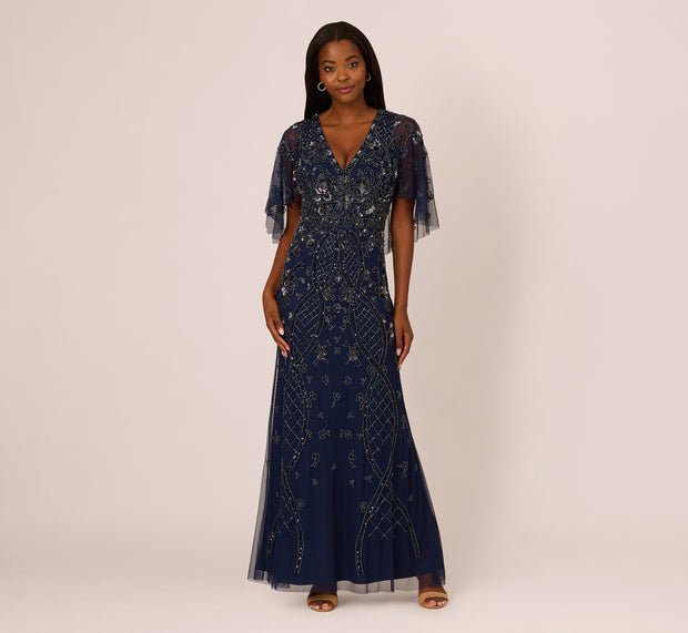 Aidan Mattox Sequin Beaded Gown With Sheer Cape Sleeves In Light Navy