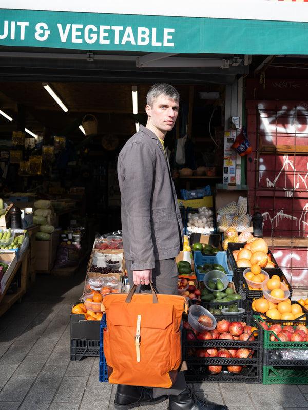 Ally Capellino Fin Waxed Cotton Backpack In Burnt