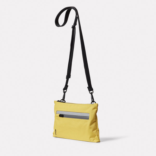 Ally Capellino Herb Travel Cycle Crossbody Bag In Lemon