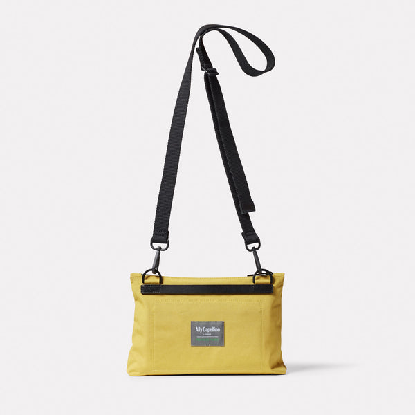 Ally Capellino Herb Travel Cycle Crossbody Bag In Lemon