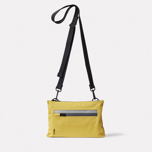 ally capellino Herb Travel Cycle Crossbody Bag in Lemon