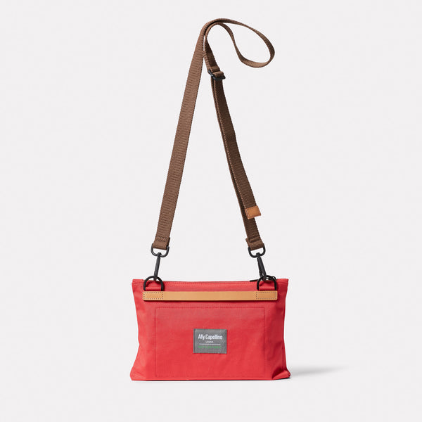 Ally Capellino Herb Travel Cycle Recycled Crossbody Bag In Crimson