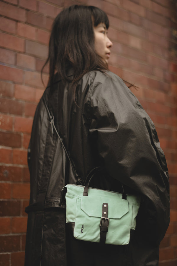 Ally Capellino Squat Waxed Cotton Crossbody Mini Bag In Aqua