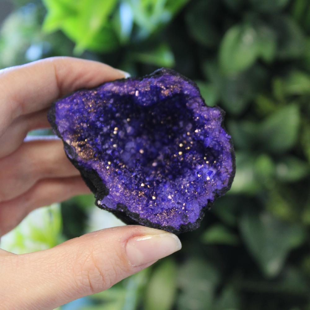 Ancient Wisdom Coloured Calcite Geode 8.5x6cm- Black Rock - Deep Purple