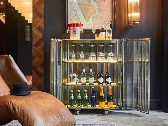 andrew martin Glass bar cabinet by Timothy Oulton