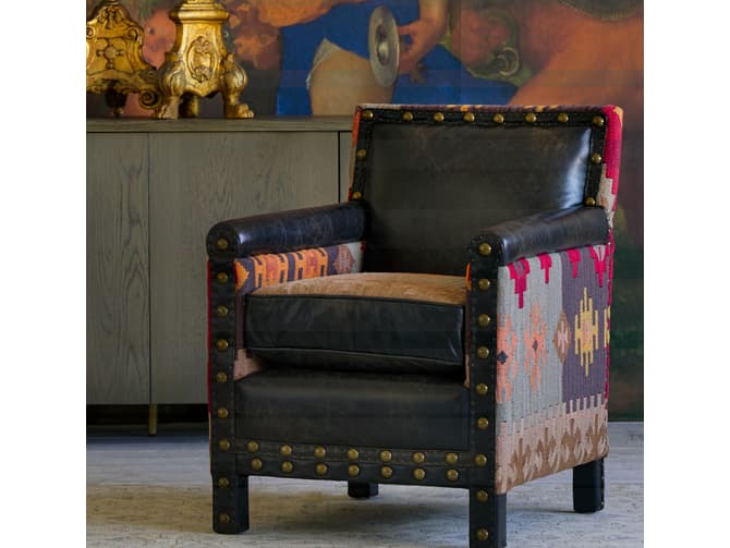andrew martin Brown leather armchair with colourful kilim back and sides