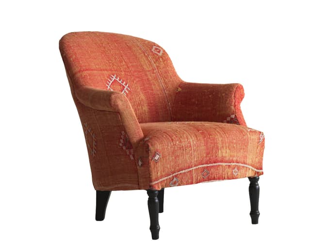 andrew martin Curved armchair in orange Moroccan fabric