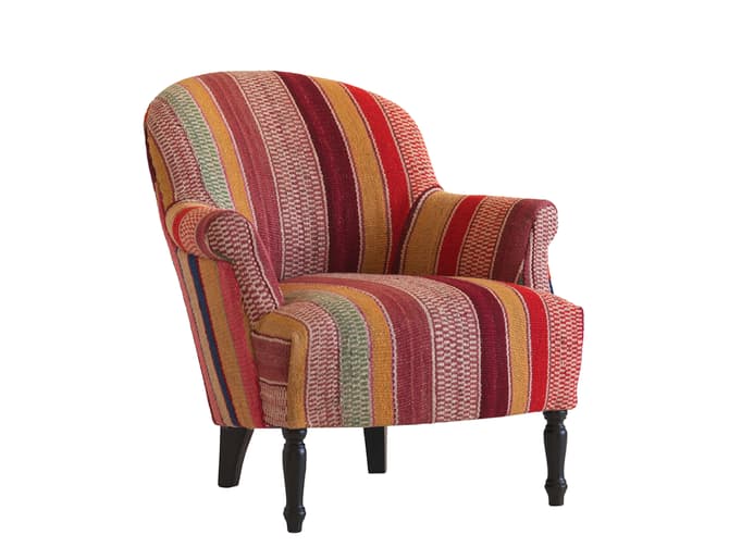 andrew martin Curved armchair in traditional Andean fabric