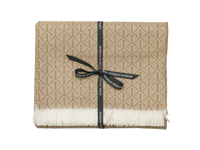 andrew martin Monte luxurious throw with fringe detailing in tan
