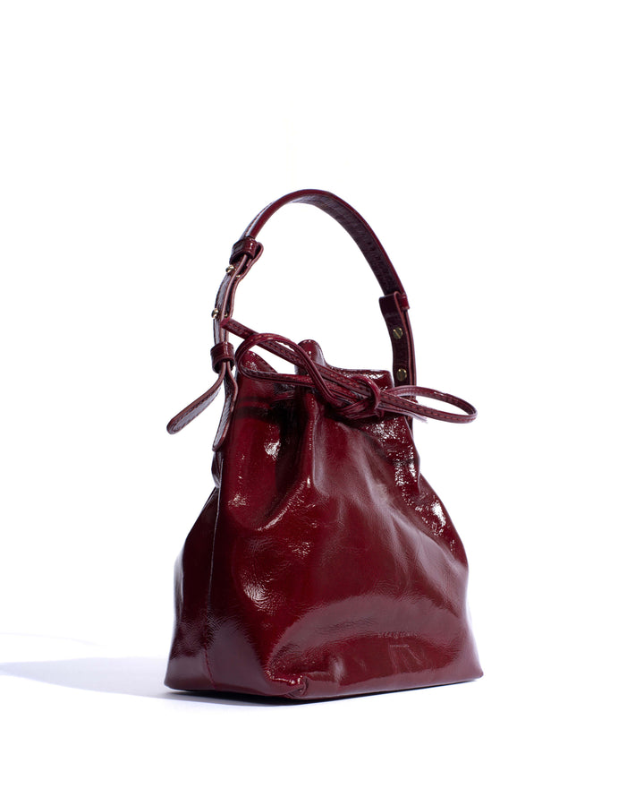 Anonymous Copenhagen Kacey Petite Bucket Bag Crinkled Polished Goat Pomegranate