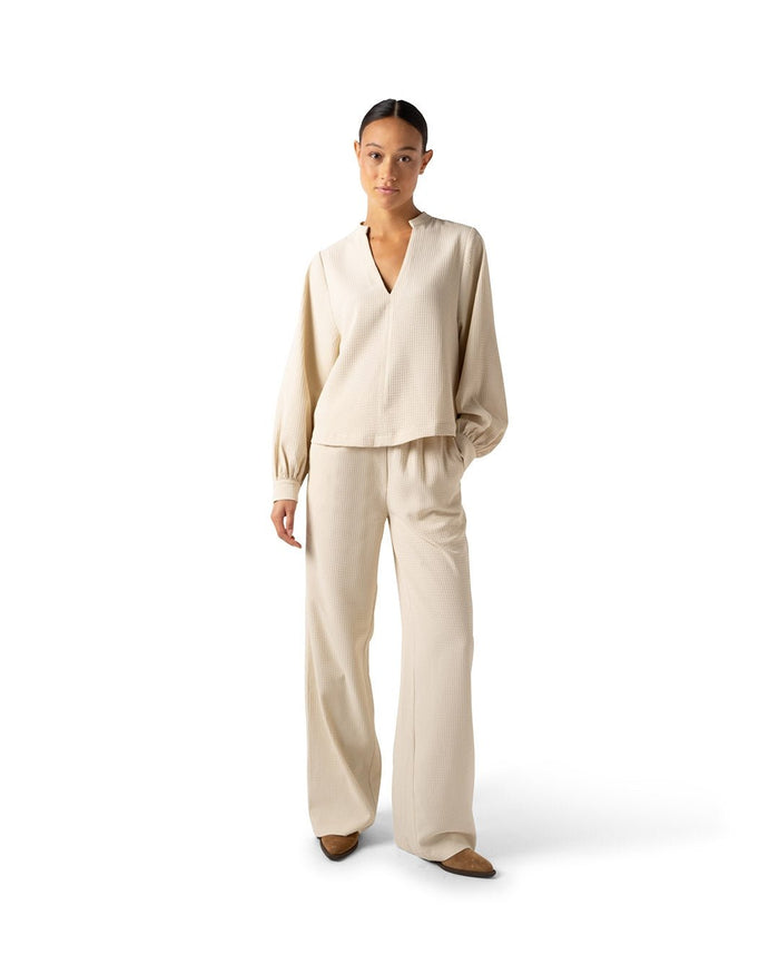 another label Dionne top Parchment