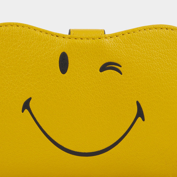 Anya Hindmarch Wink Sunglasses Holder Capra Leather In Mustard Yellow