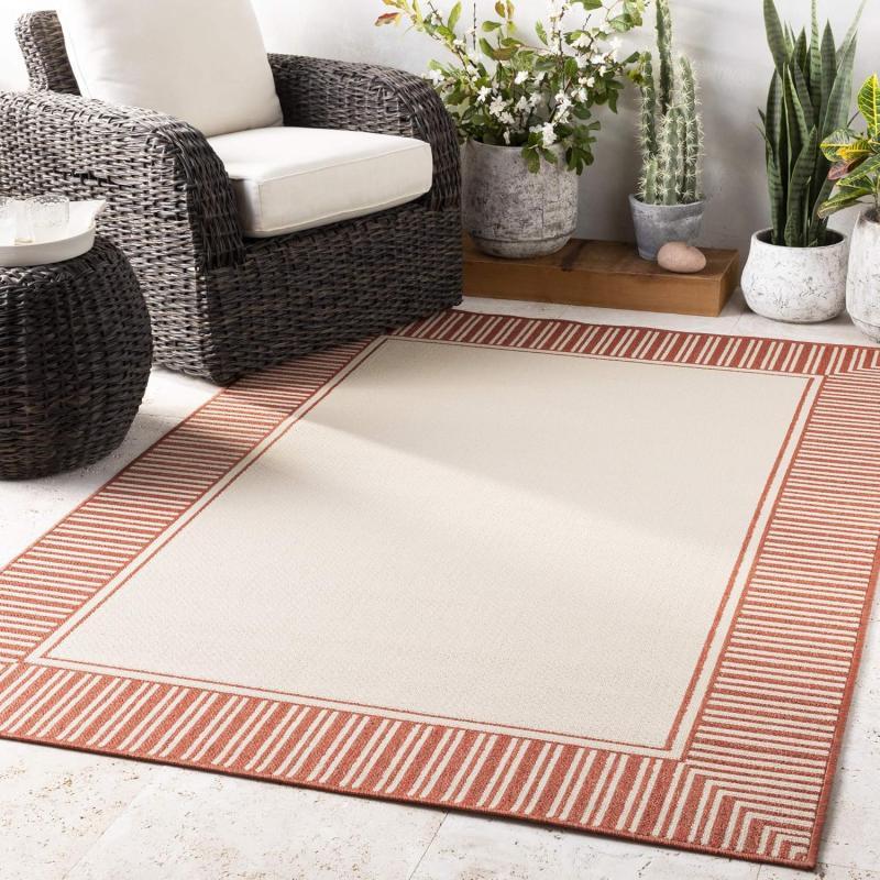 artistic weavers Livabliss Hampshire Solid Border Outdoor Area Rug 5’3″ x 7’7″ Black(Burnt Orange)