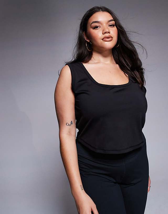 asos 4505 Curve scoop neck slightly cropped training vest in black