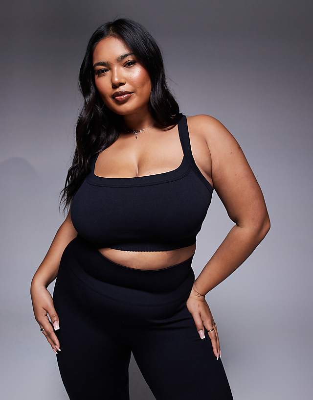asos 4505 Curve seamless sculpting medium support sports bra in black