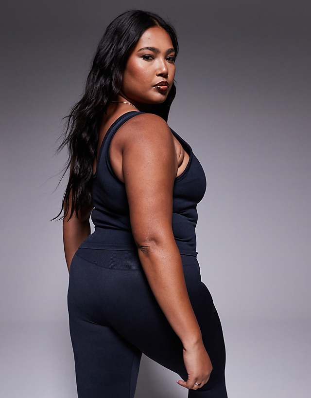 Asos 4505 Curve Seamless V Neck Vest With Inner Bra In Washed Black