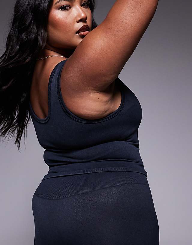 Asos 4505 Curve Seamless V Neck Vest With Inner Bra In Washed Black