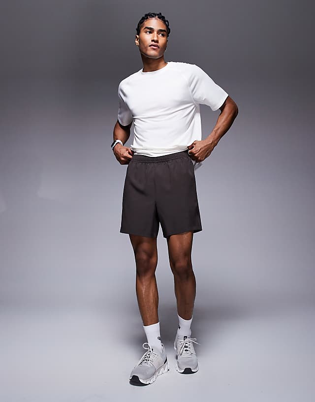 asos 4505 Icon 5 inch quick dry training shorts with zip pockets in coffee