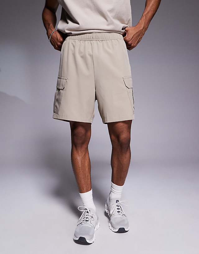 Asos 4505 Icon 7 Inch Quick Dry Training Cargo Shorts With Zip Pockets In Stone