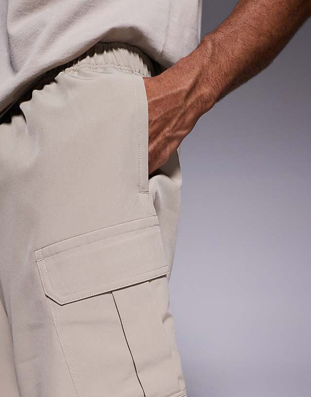 Asos 4505 Icon 7 Inch Quick Dry Training Cargo Shorts With Zip Pockets In Stone
