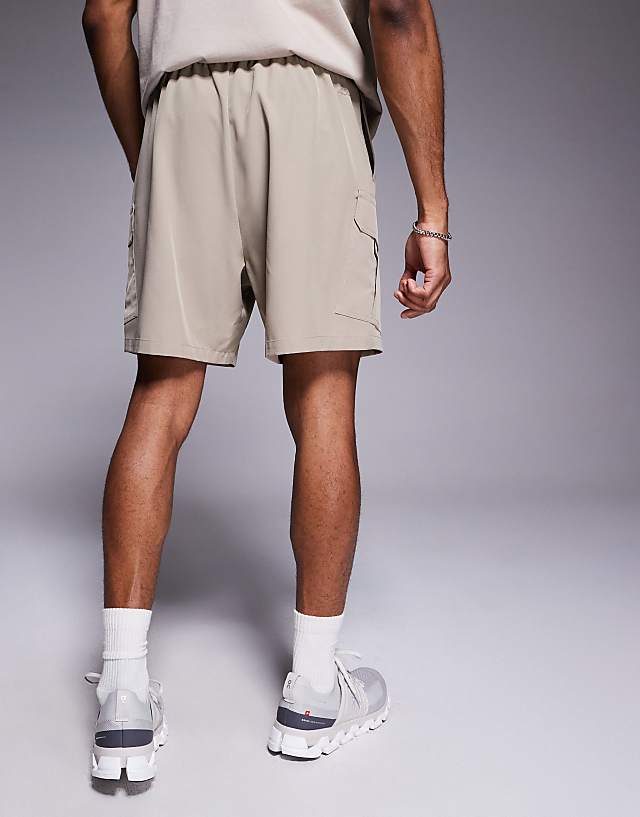 Asos 4505 Icon 7 Inch Quick Dry Training Cargo Shorts With Zip Pockets In Stone