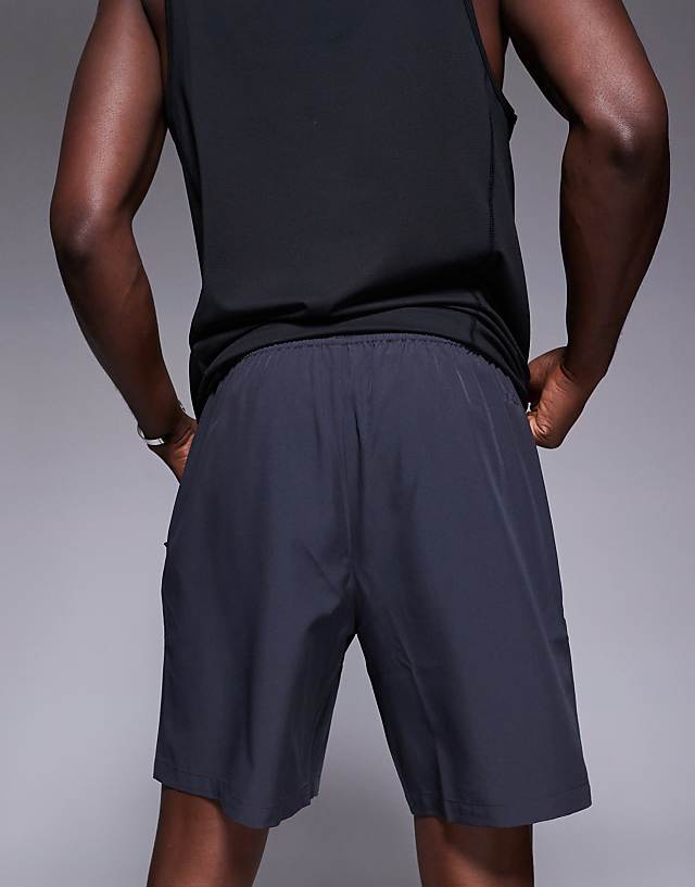 Asos 4505 Icon 7 Inch Quick Dry Training Shorts With Zip Pockets In Charcoal