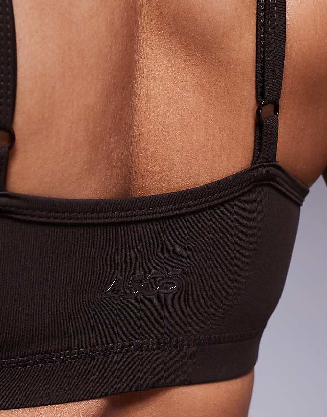 Asos 4505 Icon Soft Touch Light Support Sports Bra With Adjustable Straps In Chocolate