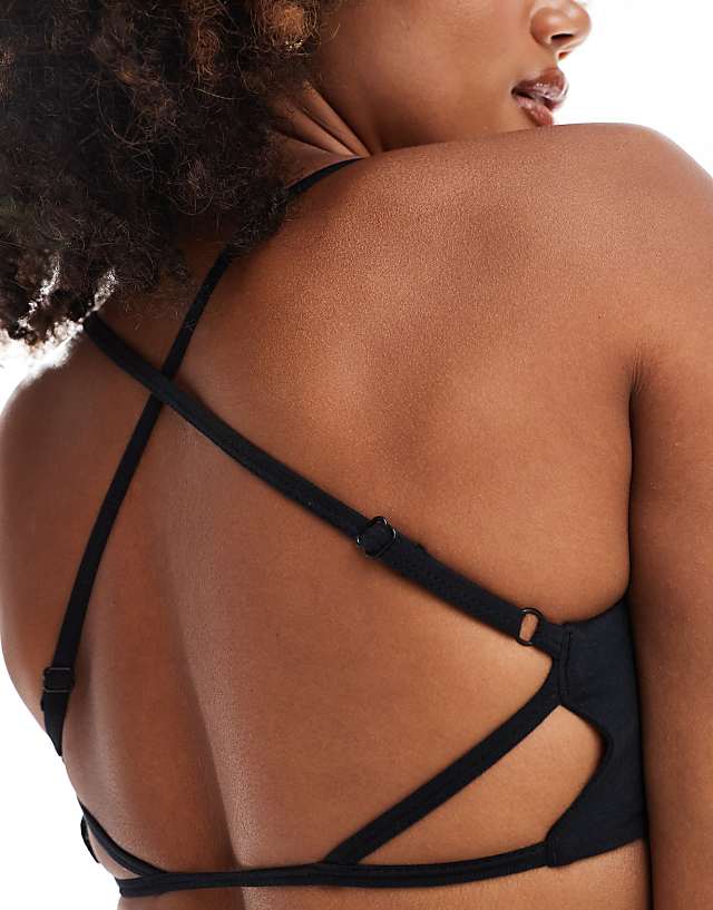 Asos 4505 Light Support Ruched Front Strap Back Sports Bra In Black