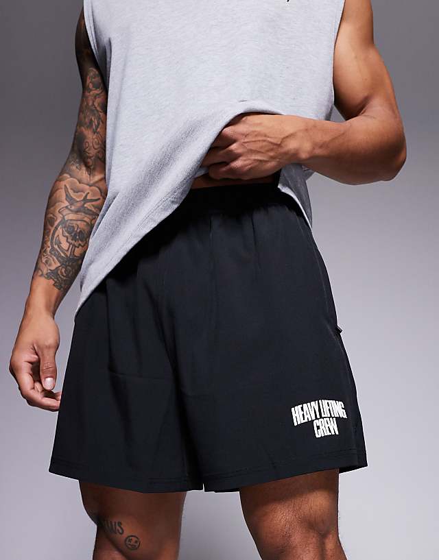 Asos 4505 Loose Fit Quick Dry Graphic Training Shorts With Zip Pockets In Black