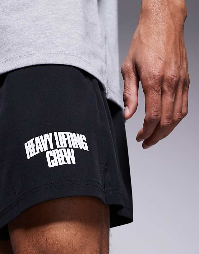 Asos 4505 Loose Fit Quick Dry Graphic Training Shorts With Zip Pockets In Black