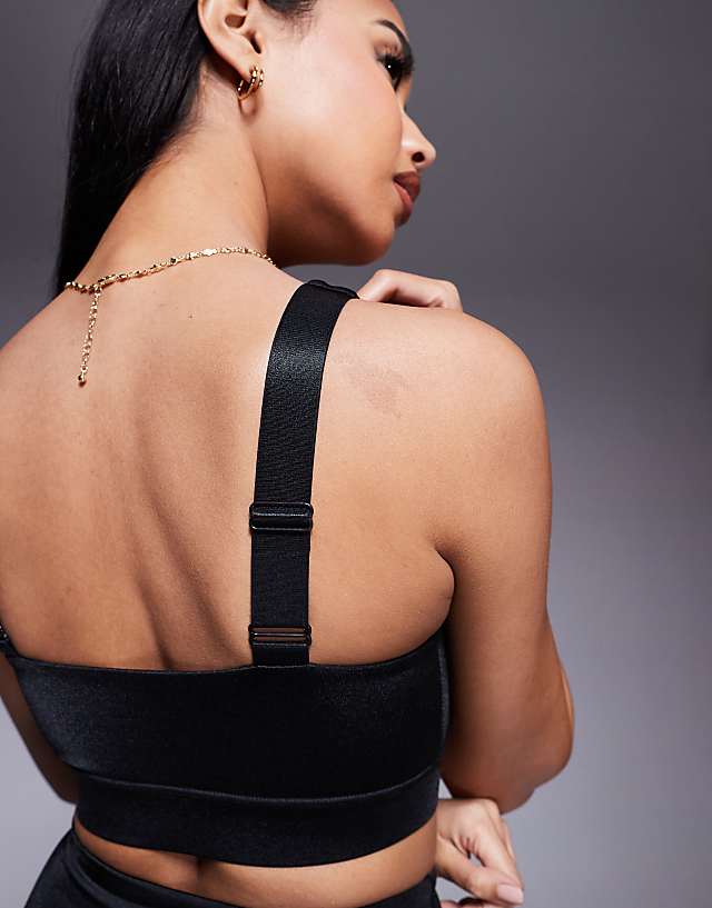 asos 4505 medium support sports bra with adjustable straps in black high shine