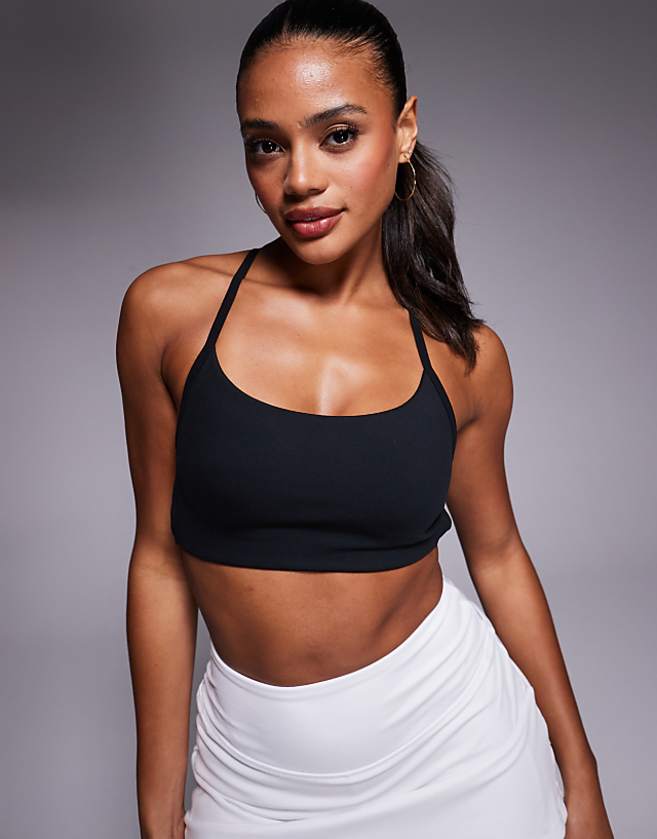 asos 4505 soft touch cross back light support sports bra in black