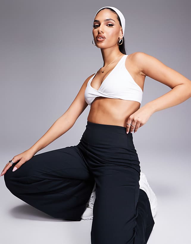 asos 4505 soft touch light support twist front sports bra in white