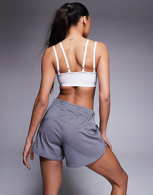 Asos 4505 Soft Touch Rib Light Support Sports Bra With Adjustable Straps In White