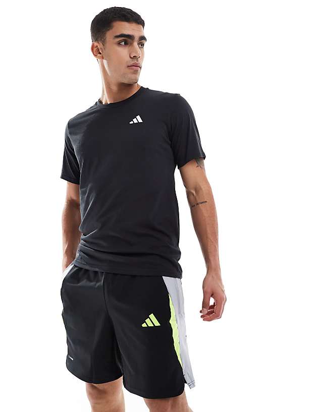 asos adidas Football tech shorts in black grey and yellow